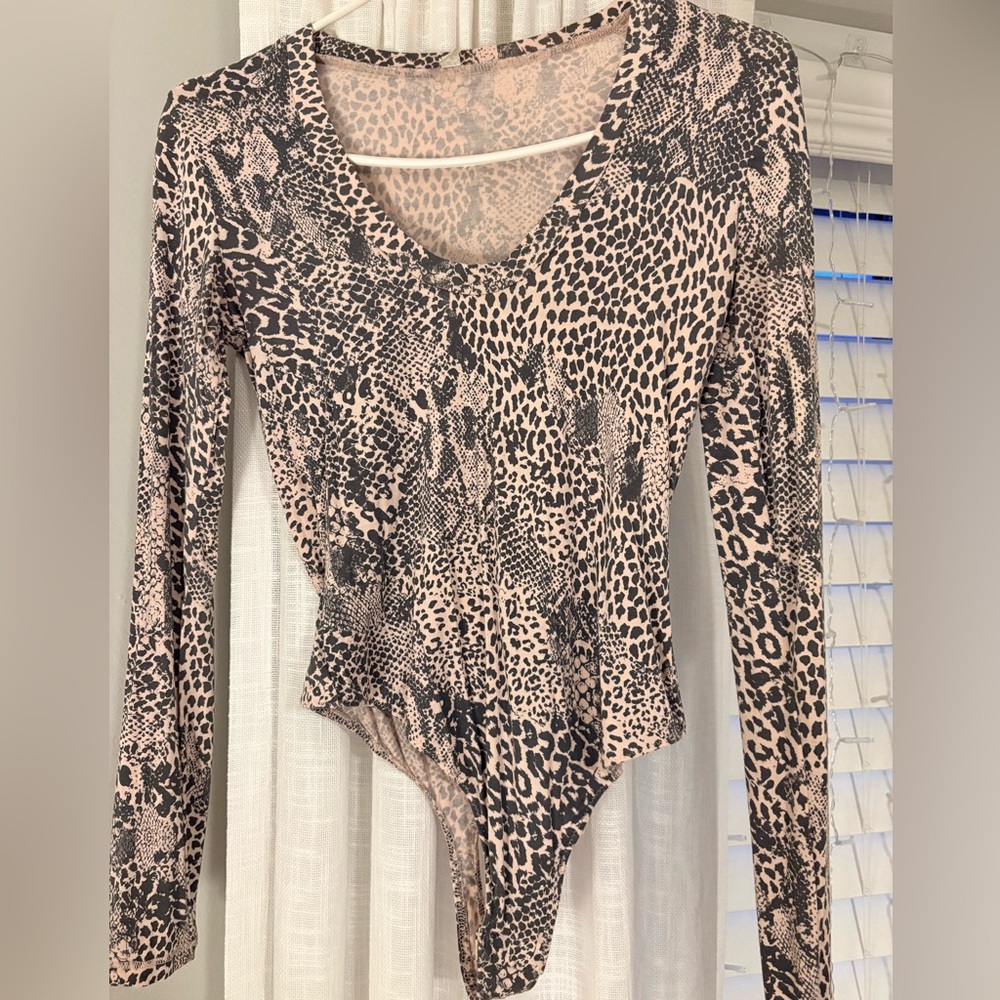 Intimately Free People. Animal Print Long sleeve body suit. Size S.
